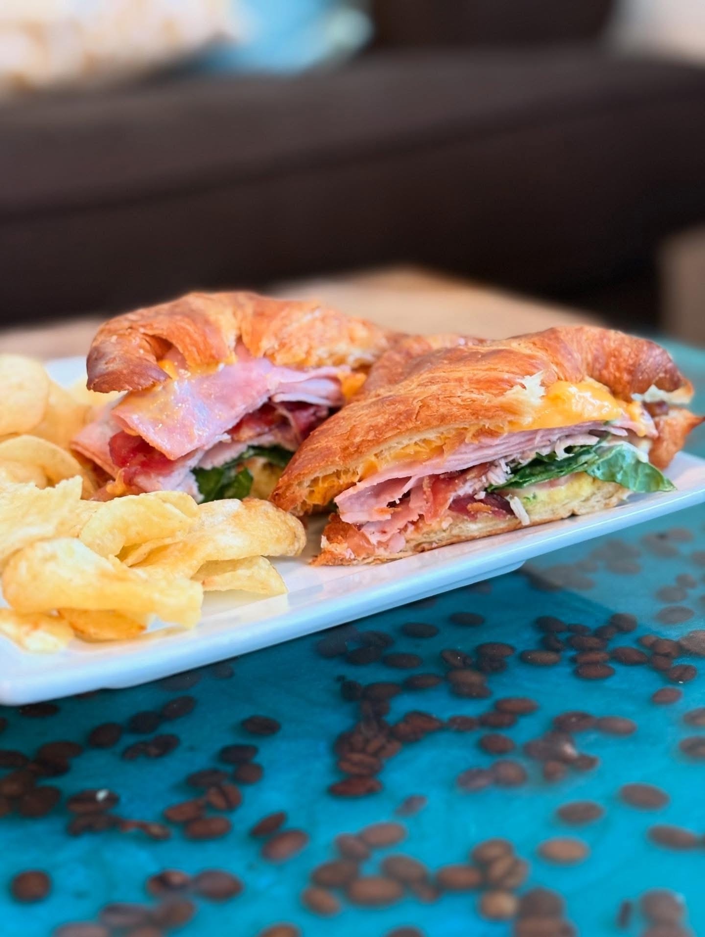 Hot croissant sandwich with chips at Boozer's Brew